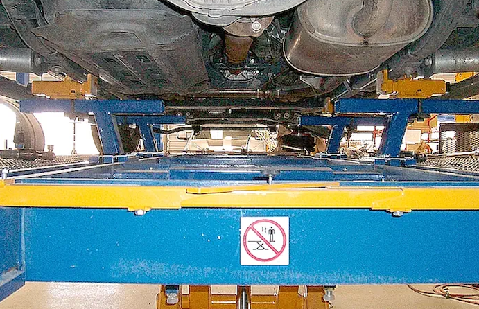 Car-O-Liner truck frame clamps mounted on frame repair bench